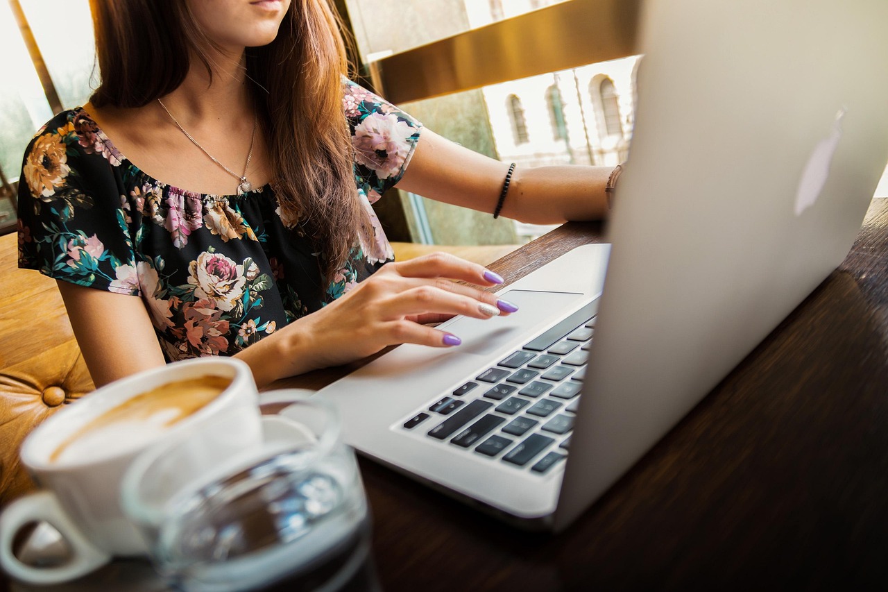 Woman scheduling lessons on a laptop